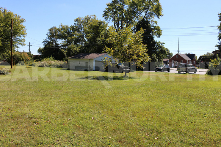 .77 Acre lot and storage garage 