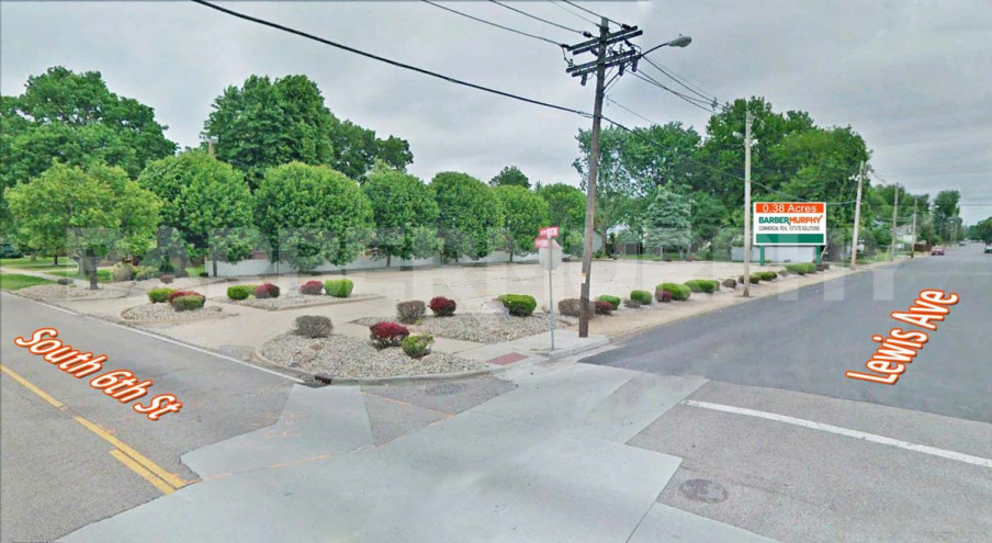 Street view of paved corner commercial site across from new Wood River Police Station at 179 S 6th St, Wood River, IL 62095, Madison County, SW Illinois